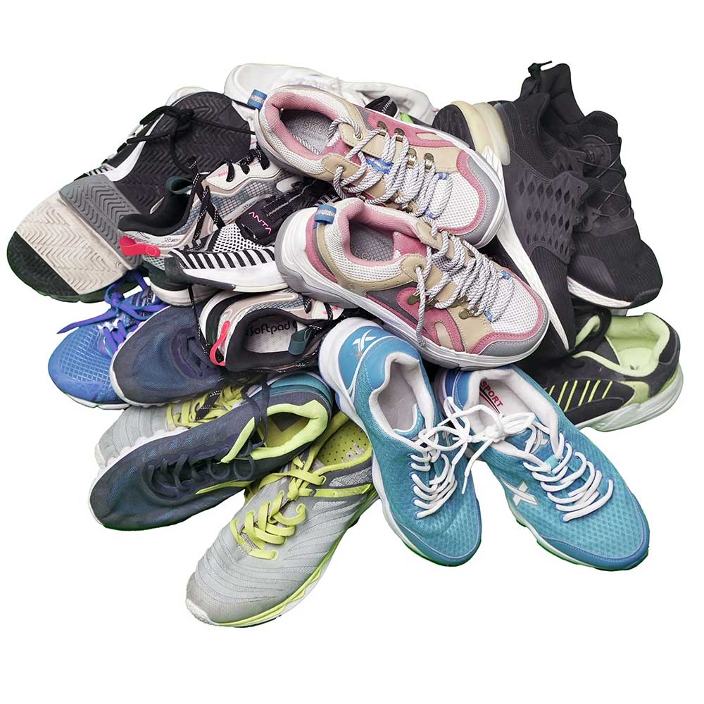 a sorted pile of China-braded used men's shoes